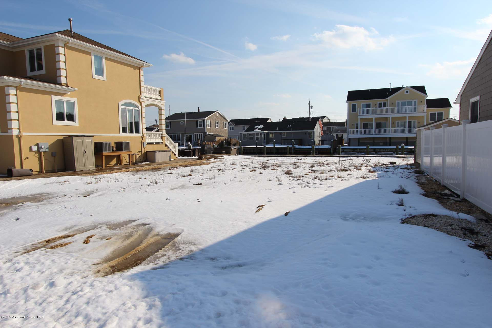219 South Lagoon Road Lavallette, NJ 08735 - Photo 2 of 4 a view of a parking space in the house