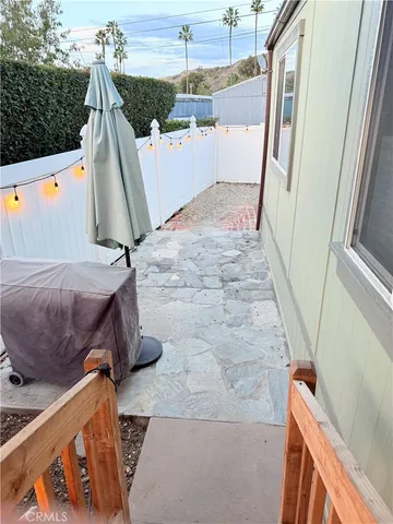 a kitchen with stainless steel appliances granite countertop a stove a sink dishwasher and a refrigerator