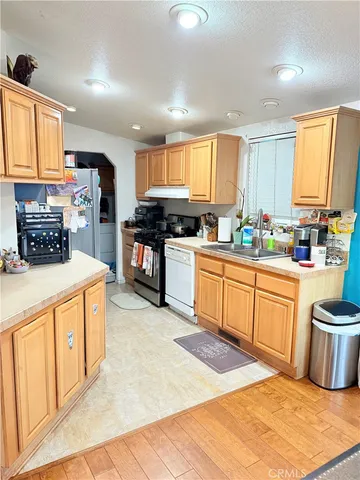 a view of a kitchen with appliances