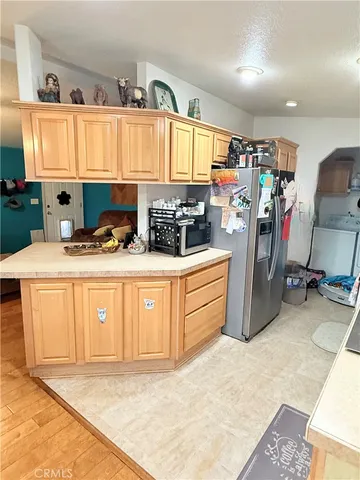 a kitchen with a stove a sink and a refrigerator
