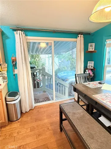 a living room with furniture and a pool table