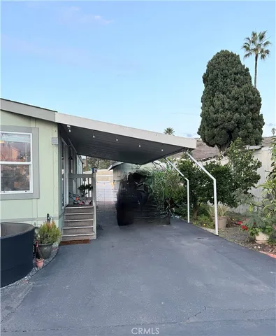 a view of a patio with table and chairs