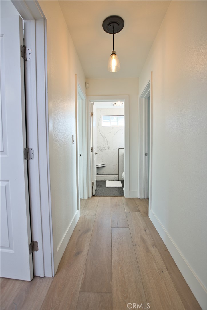 6091 Dundee Drive Huntington Beach, CA 92647 - Photo 16 of 55 a view of a room with a wardrobe space and a sink