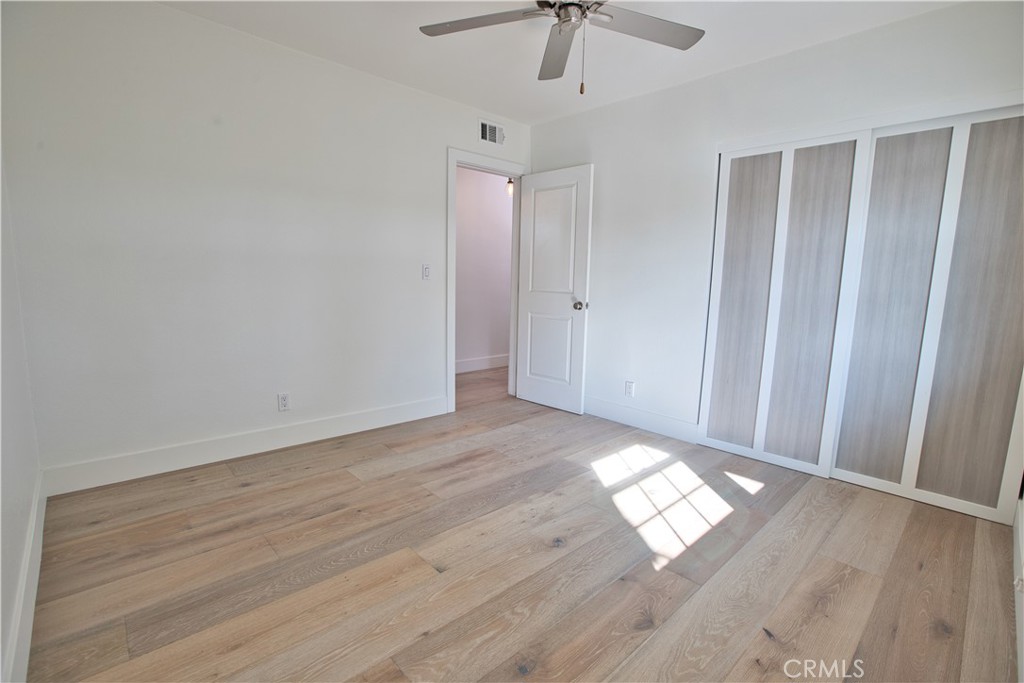 6091 Dundee Drive Huntington Beach, CA 92647 - Photo 20 of 55 wooden floor in an empty room with a window
