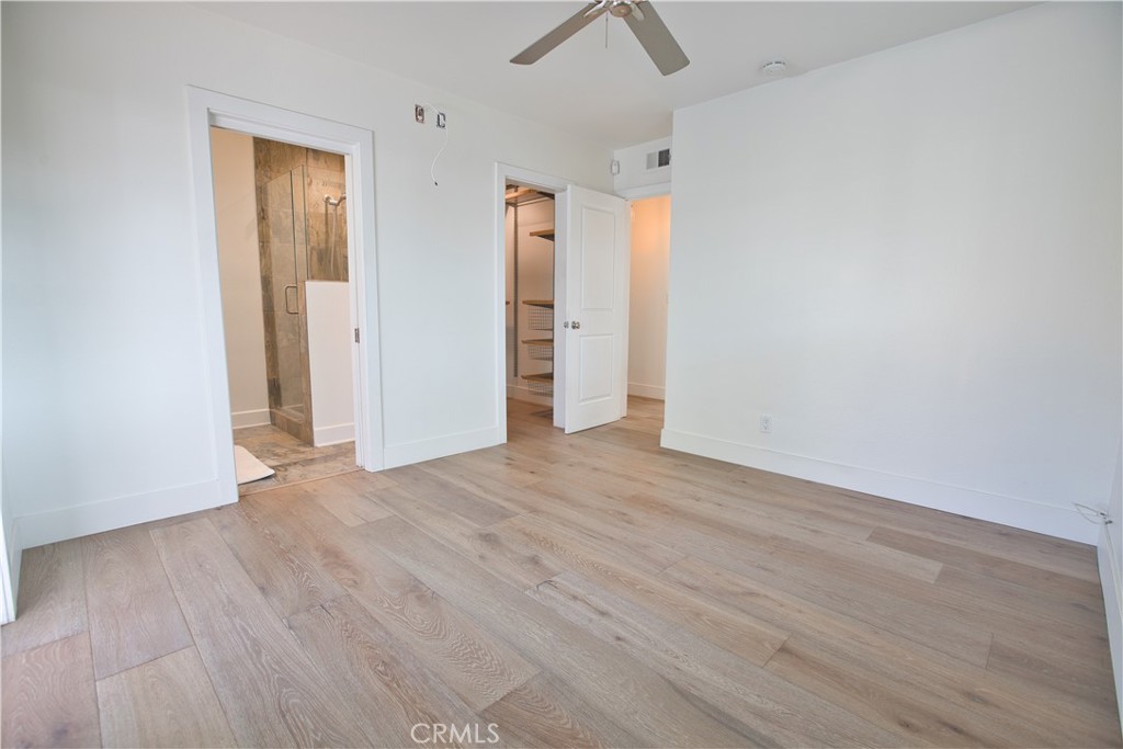 6091 Dundee Drive Huntington Beach, CA 92647 - Photo 22 of 55 an empty room with wooden floor and closet