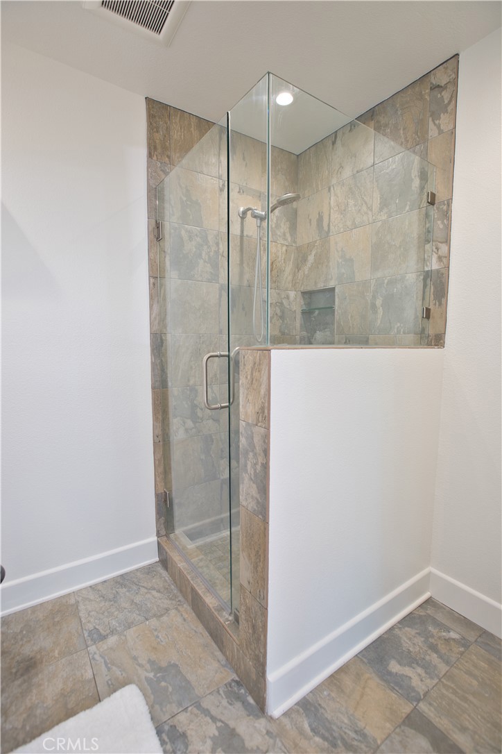 6091 Dundee Drive Huntington Beach, CA 92647 - Photo 27 of 55 a bathroom with a shower