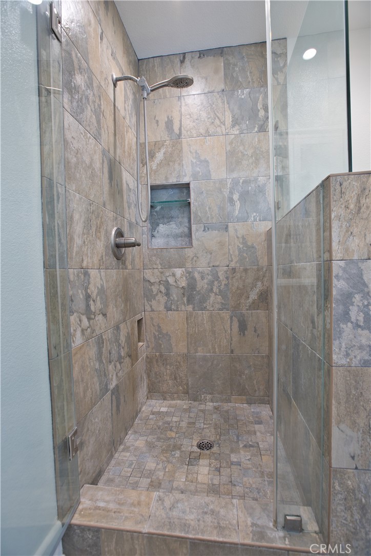 6091 Dundee Drive Huntington Beach, CA 92647 - Photo 28 of 55 a bathroom with a shower
