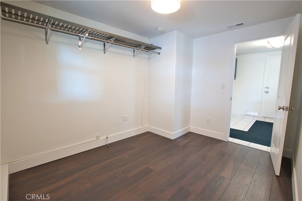 6091 Dundee Drive Huntington Beach, CA 92647 - Photo 34 of 55 wooden floor in an empty room