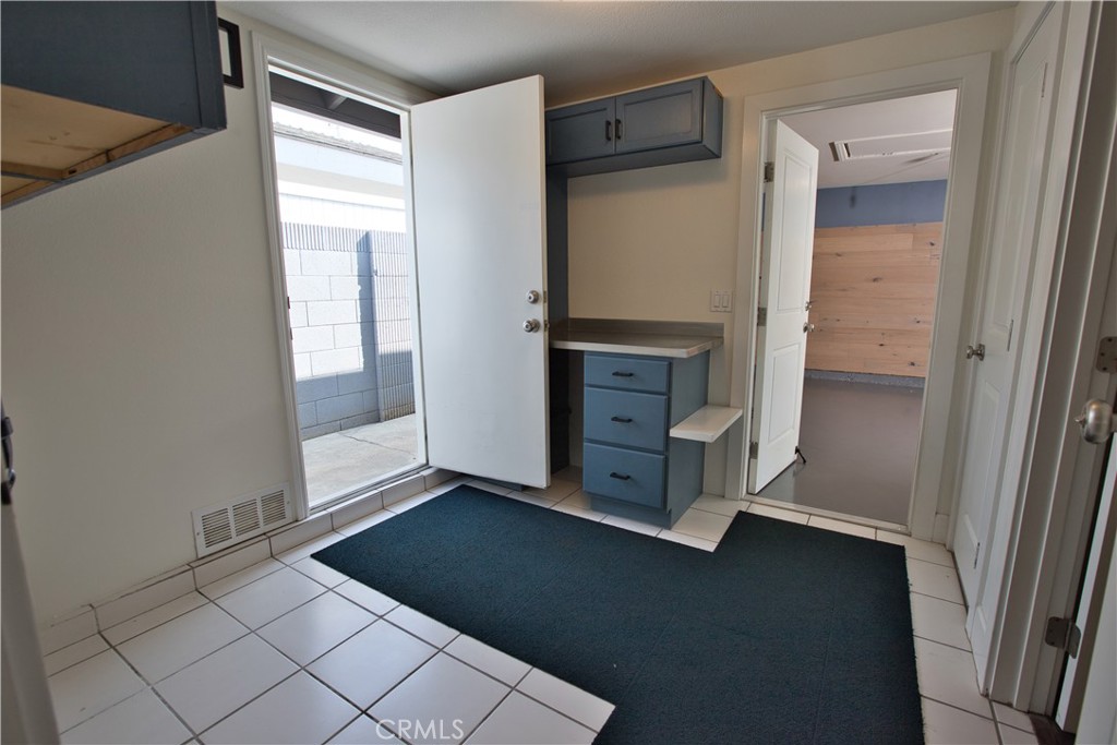 6091 Dundee Drive Huntington Beach, CA 92647 - Photo 36 of 55 an empty room with windows