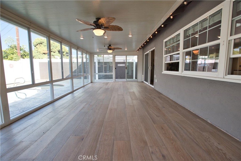 6091 Dundee Drive Huntington Beach, CA 92647 - Photo 44 of 55 wooden floor in an empty room with a window