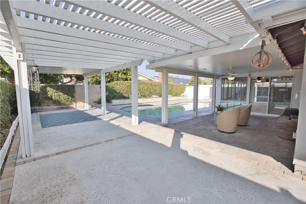 6091 Dundee Drive Huntington Beach, CA 92647 - Photo 46 of 55 a view of a porch with chairs