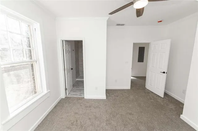 a view of an empty room with a window