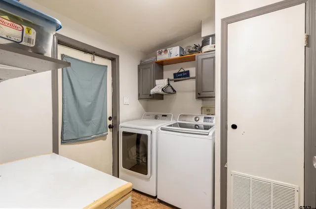 a kitchen with a refrigerator and a stove