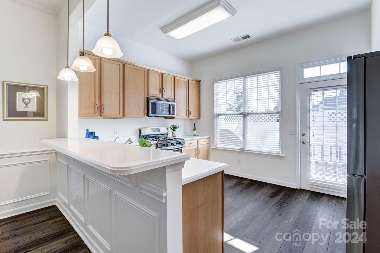 120 Falling Ridge Belmont, NC 28012 - Photo 7 of 18 a kitchen with a sink window and cabinets