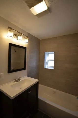 a bathroom with a sink and a bathtub