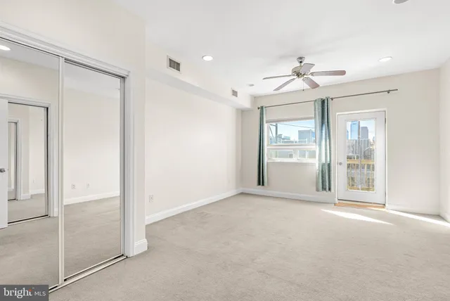 a view of an empty room with a window