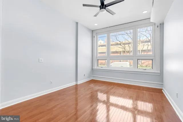 a view of an empty room with a window