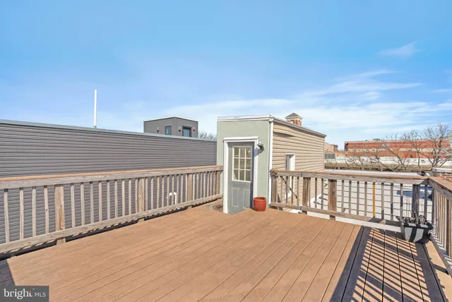 a view of balcony with wooden floor