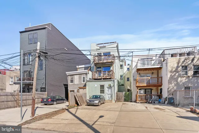 a front view of a building with street view