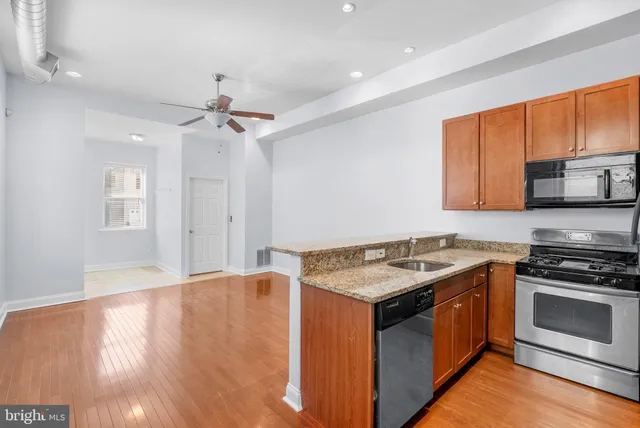 a kitchen with a stove and a microwave