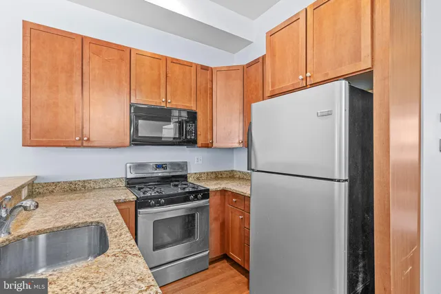 a white refrigerator freezer sitting in a kitchen