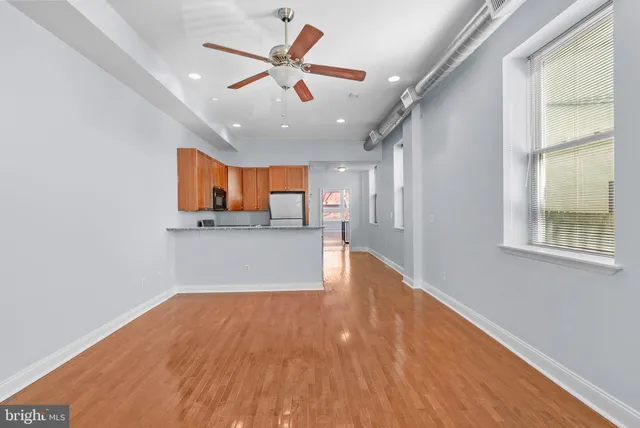 a view of a kitchen with a sink and a window