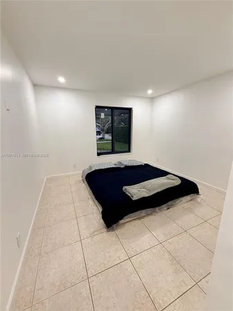 a bedroom with a bed and a walk in closet