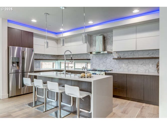 14 Northwest Hood Street Camas, WA 98607 - Photo 12 of 36 a kitchen with stainless steel appliances granite countertop a sink counter space and cabinets