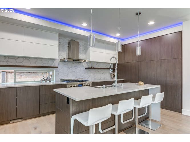 14 Northwest Hood Street Camas, WA 98607 - Photo 13 of 36 a kitchen with stainless steel appliances kitchen island granite countertop a sink and cabinets