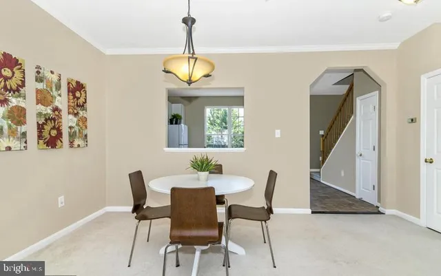 a white sink sitting under a bathroom mirror