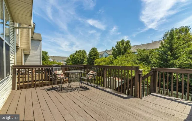 a view of a swimming pool with outdoor seating