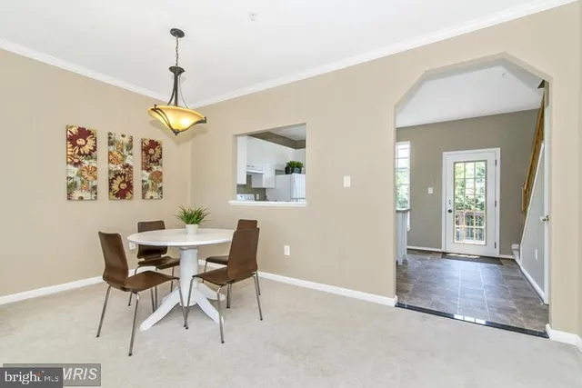 a kitchen with stainless steel appliances granite countertop a stove a sink and a white cabinets