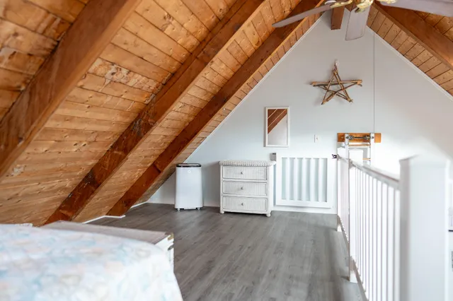 a view of staircase with white walls and railing