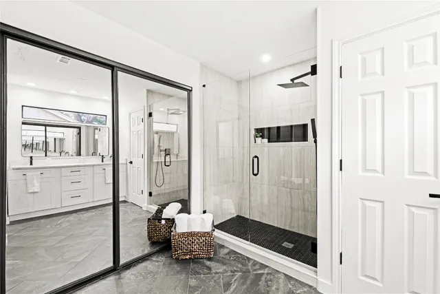 a living room with furniture and view of kitchen