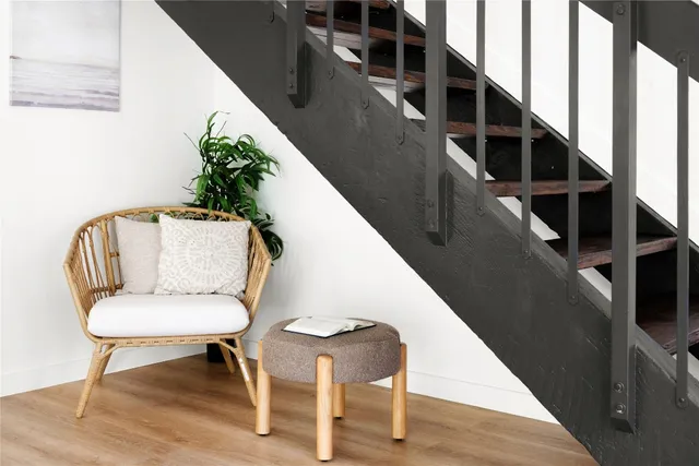 a bedroom with a bed and a night stand