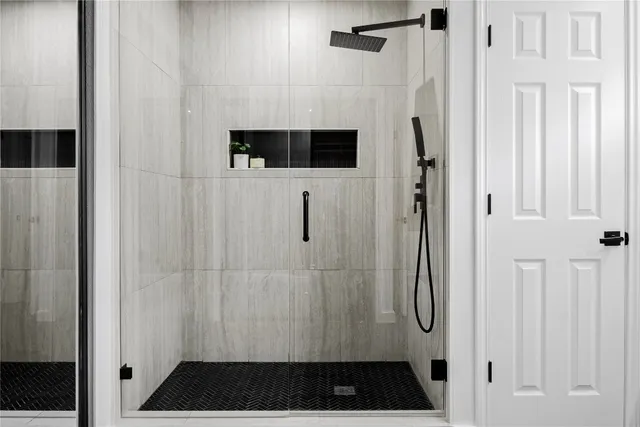 a bathroom with a sink vanity and mirror