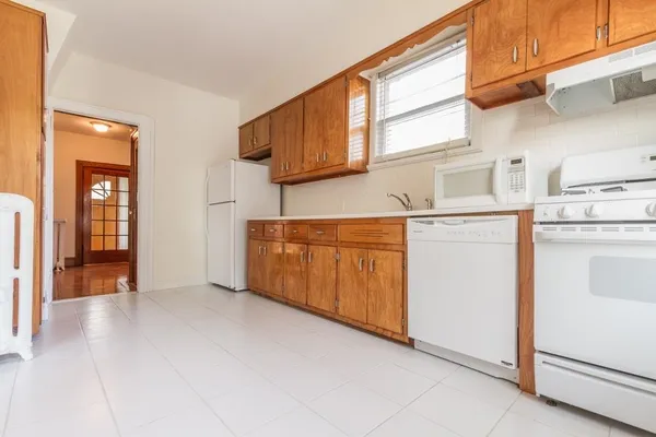 a view of a kitchen with utility and utility