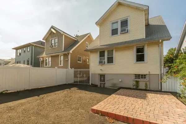 a view of a house with a wooden deck