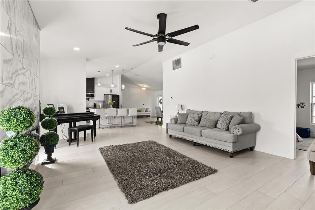 812 Chastain Road Seffner, FL 33584 - Photo 9 of 26 a living room with furniture and a table