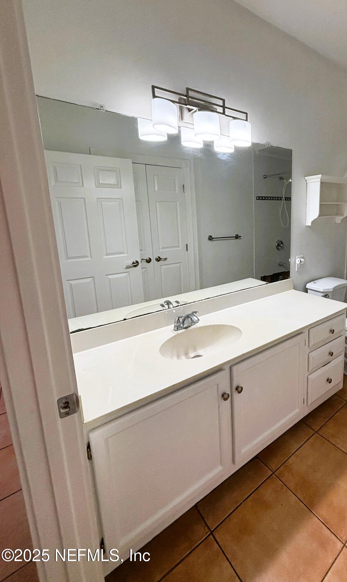 201 Colima Court, Unit 1211 Ponte Vedra Beach, FL 32082 - Photo 20 of 35 a bathroom with a sink double vanity and a mirror