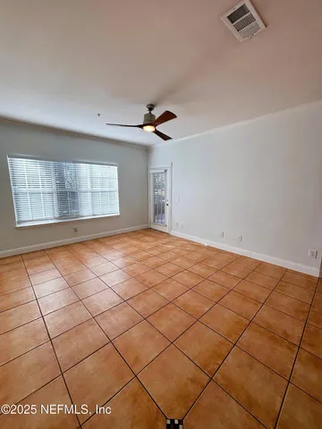 a view of an empty room and window