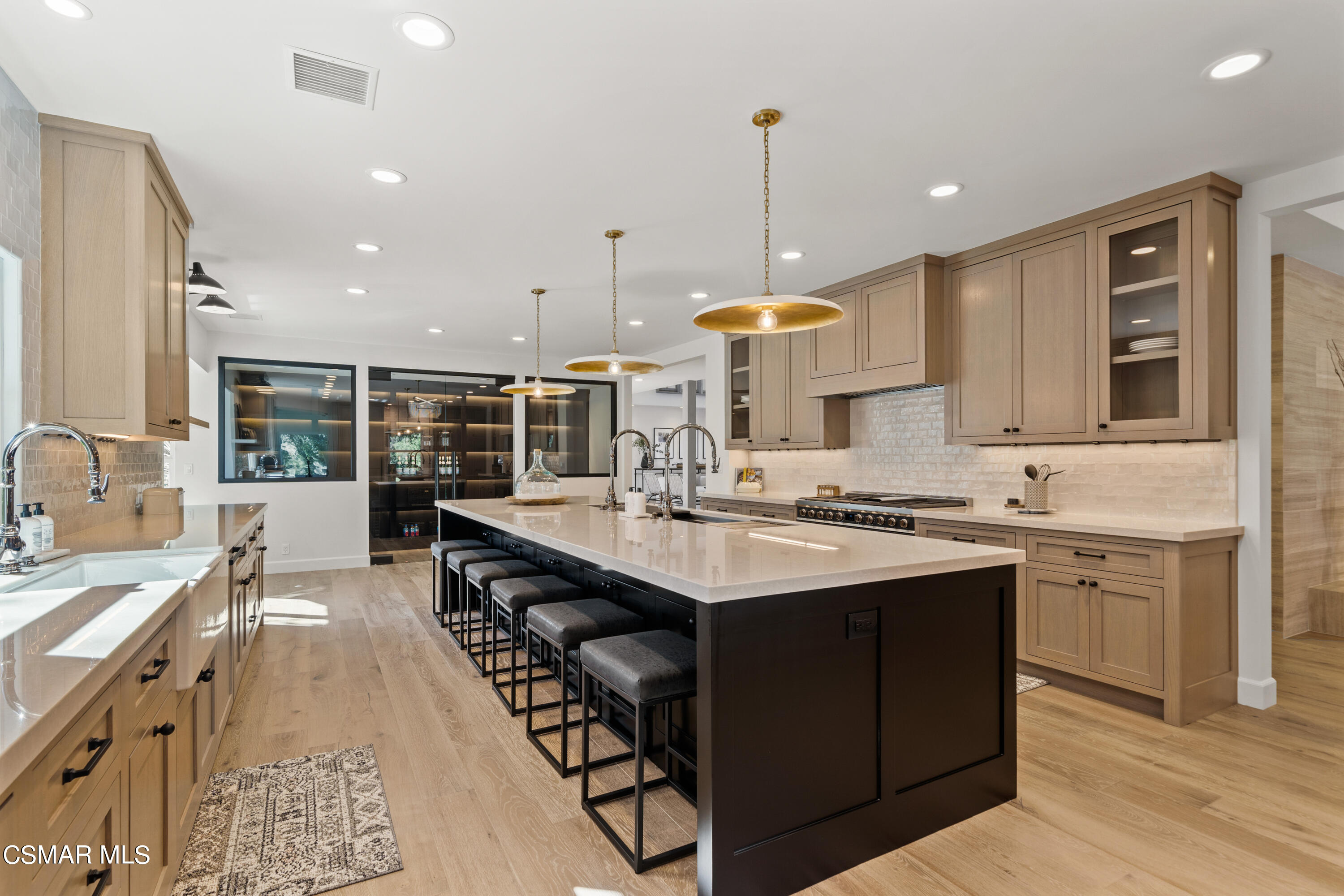 1515 Hidden Valley Road Thousand Oaks, CA 91361 - Photo 22 of 56 a kitchen with a sink stove and wooden cabinets