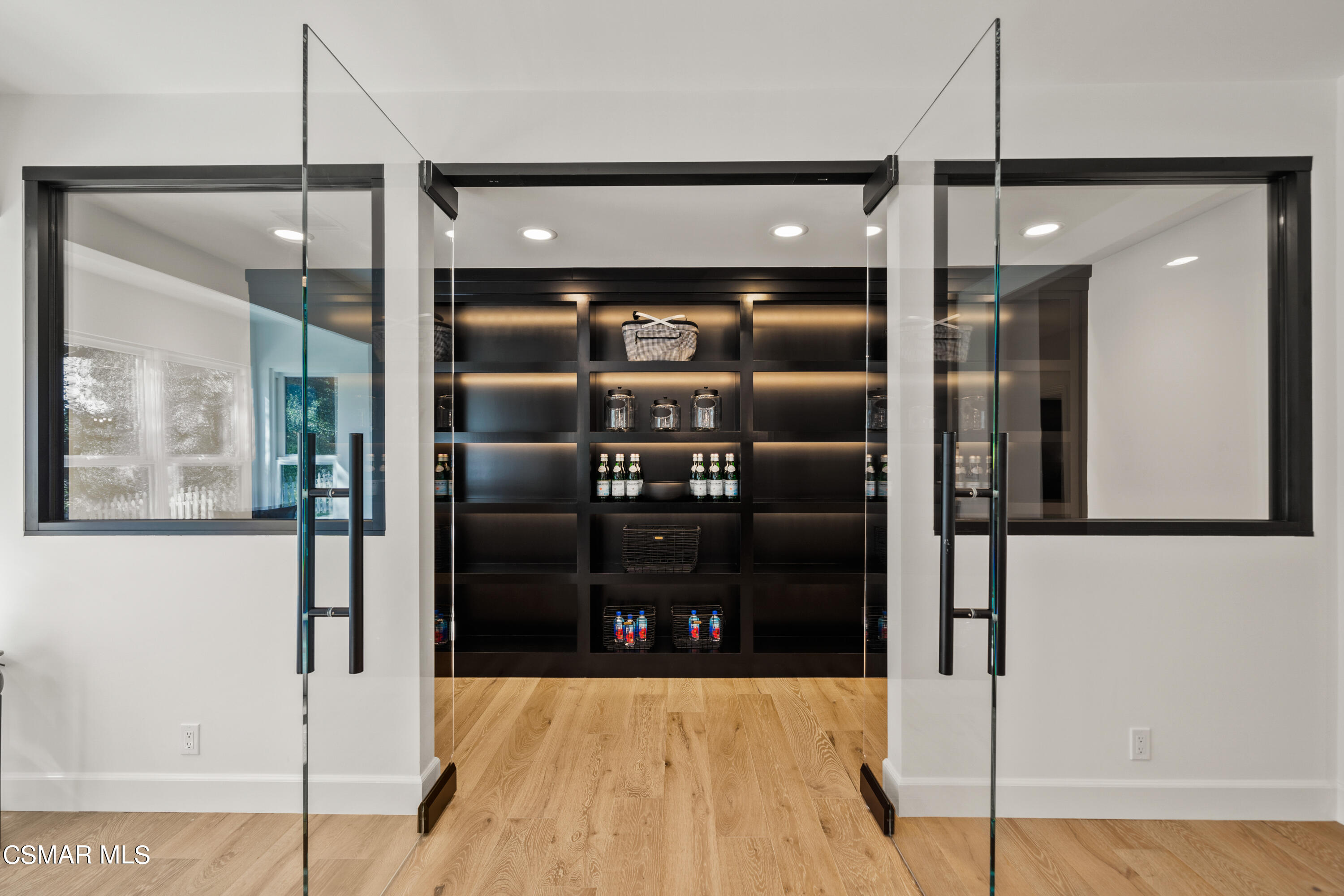 1515 Hidden Valley Road Thousand Oaks, CA 91361 - Photo 24 of 56 a kitchen with stainless steel appliances kitchen island a refrigerator and a sink