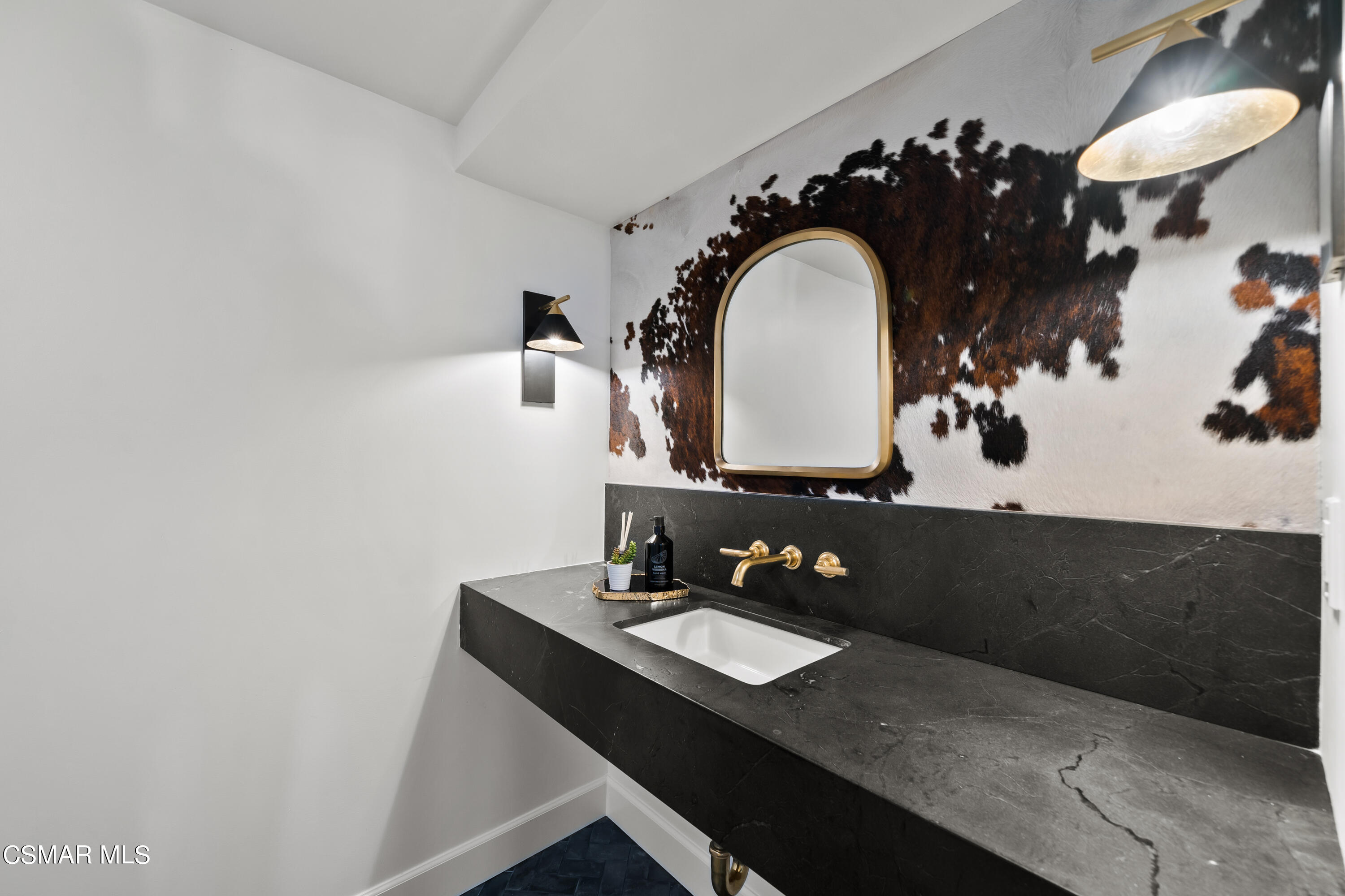 1515 Hidden Valley Road Thousand Oaks, CA 91361 - Photo 32 of 56 a bathroom with a sink and a mirror