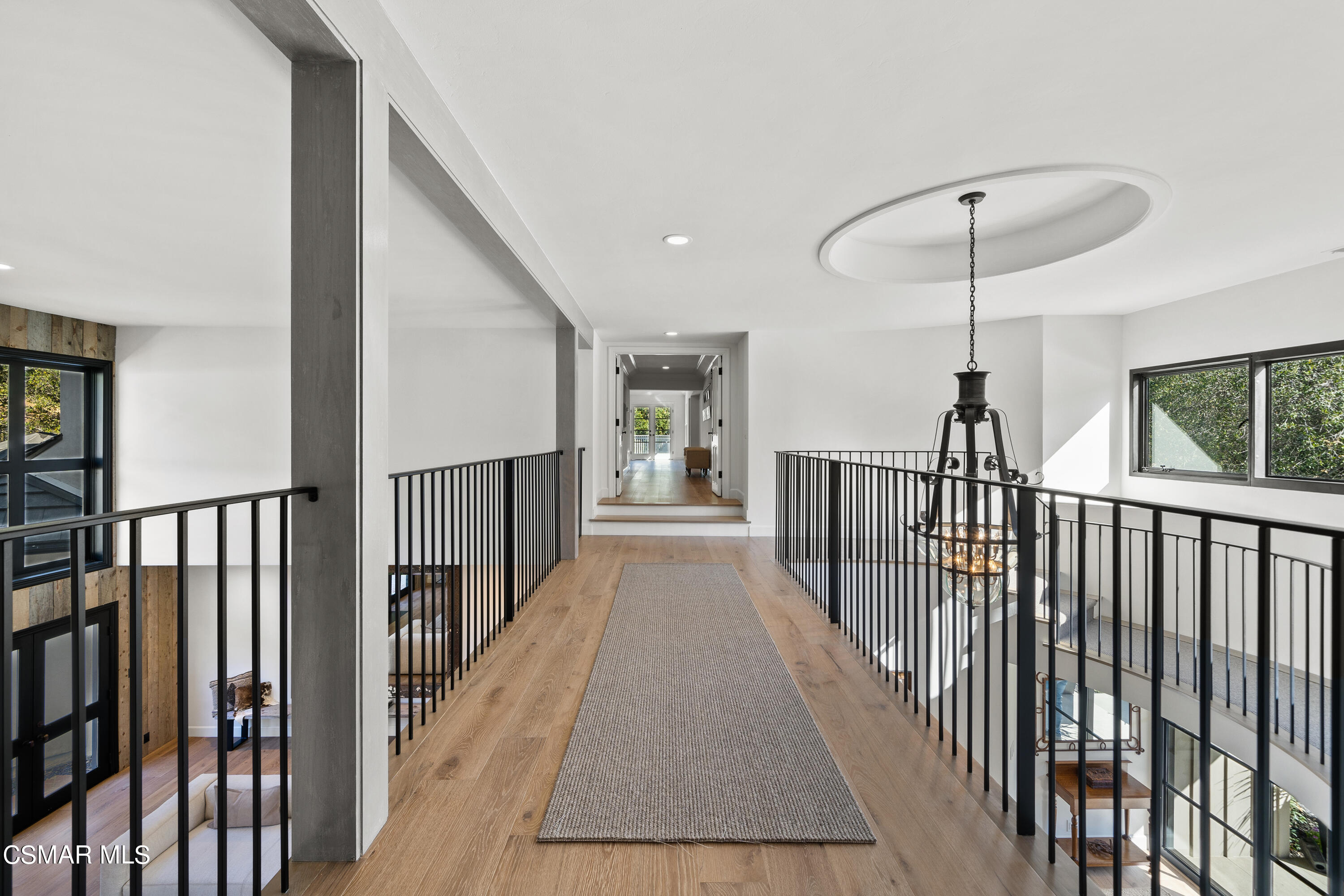 1515 Hidden Valley Road Thousand Oaks, CA 91361 - Photo 39 of 56 a view of a hallway with wooden floor and stairs
