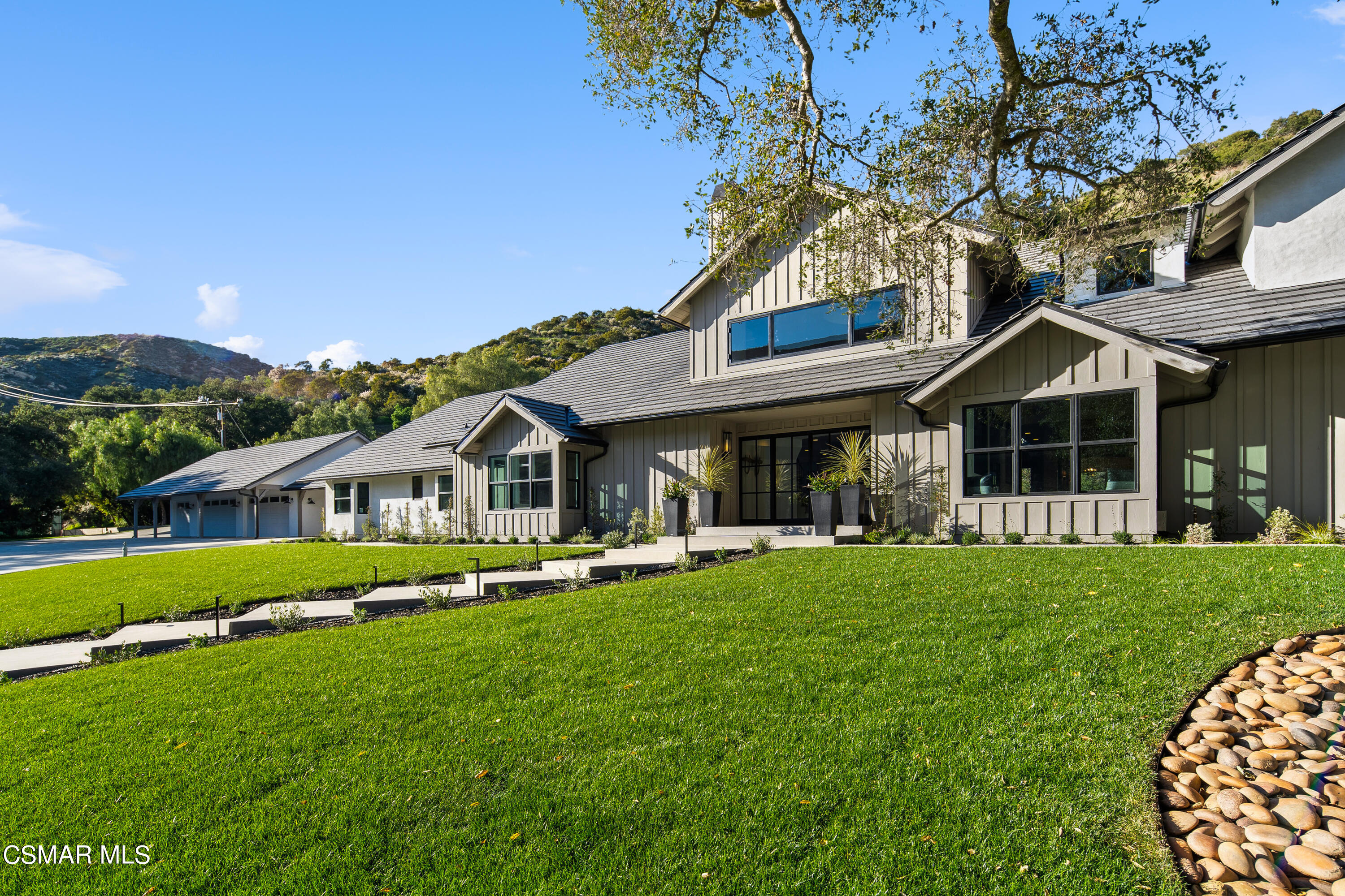 1515 Hidden Valley Road Thousand Oaks, CA 91361 - Photo 5 of 56 a front view of a house with a garden