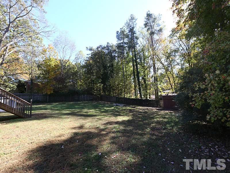 11609 Strickland Road Raleigh, NC 27613 - Photo 11 of 25 Big Fenced Backyard with NEW Shed '15, NEW Septic Tank '14, NEW Water Heater '14, and NO HOA Dues!