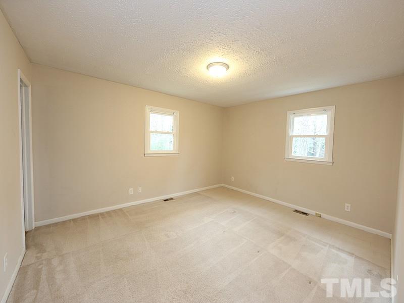 11609 Strickland Road Raleigh, NC 27613 - Photo 7 of 25 Massive Master Bedroom, 15.3 x 12.7, with NEW Energy Efficient Windows '16, NEW Paint '14, Overhead Light, and Freshly Cleaned Carpet! (There Appear to Be HARDWOOD Floors Underneath the Carpet)