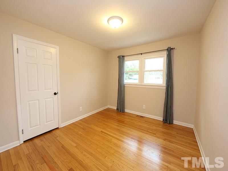 11609 Strickland Road Raleigh, NC 27613 - Photo 9 of 25 Second Bedroom, 15.3 x 11.7, with Refinished HARDWOODS '14, NEW Energy Efficient Windows '16, NEW Paint '14, Overhead Light, and Big Closet!