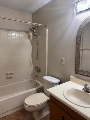 a bathroom with a sink a mirror and a toilet